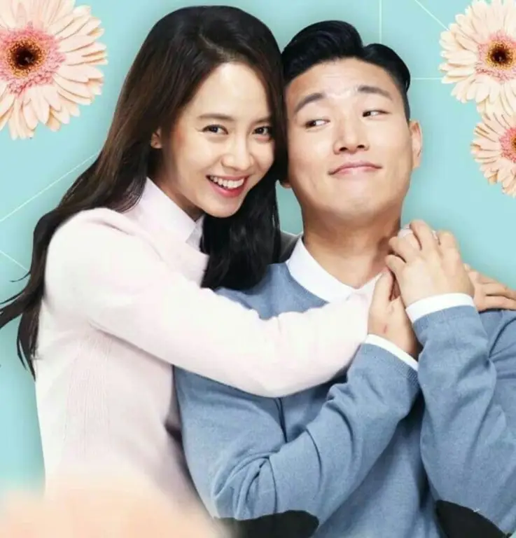 Pasangan menikmati waktu bersama sambil menonton drama Korea Pasangan sedang menonton drama Korea
